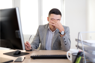 Frustrated worker with headache