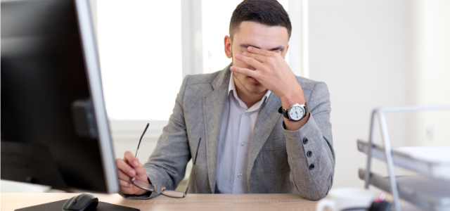 Frustrated worker with headache